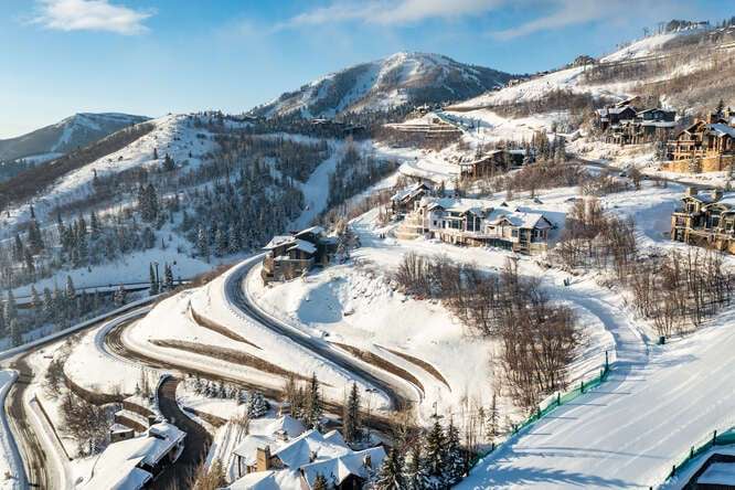 Aerial view of Deer Valley luxury mountain residences with ski runs and winter landscape